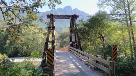 Entrance-to-a-wooden-suspension-bridge-in-Baring,-Washington