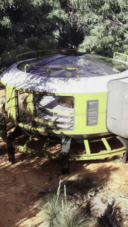 futuristic pod nestled in lush forest environment during daytime exploration