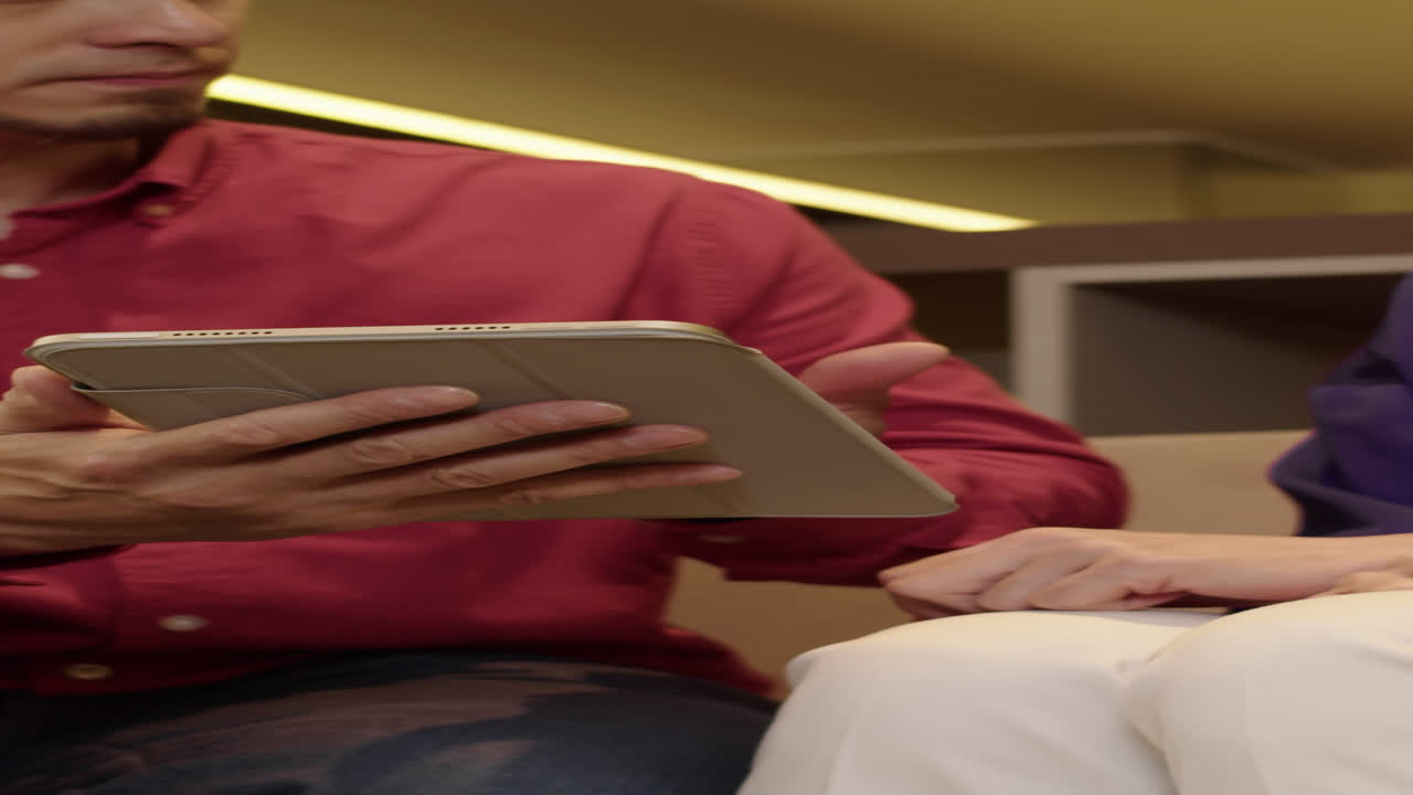 Coworkers Using Tablet Computer when Talking about Work