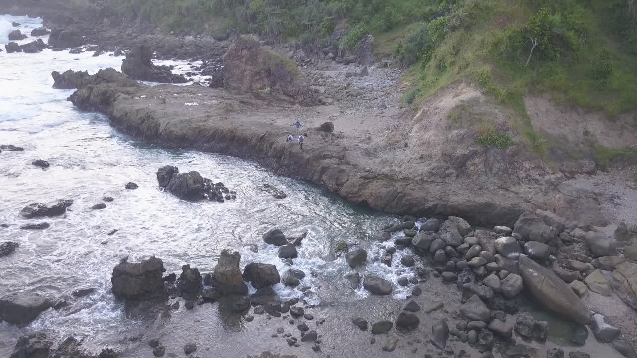 Watu Lumbung Beach in Gunungkidul, Yogyakarta. A beach with unique large rocks and corals. The waves crash against each coral.