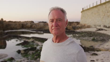 Front-view-senior-man-at-beach