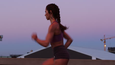 woman running at sunset in the city