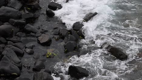 ocean waves interacting with coastal rocks