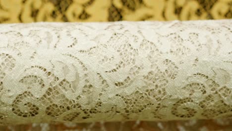 macro shot of a lace, fabric used to make elegant wedding dresses for the wedding day.