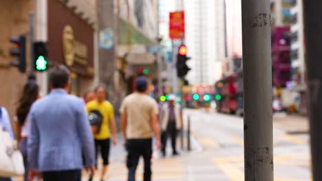 people walking across a city intersection