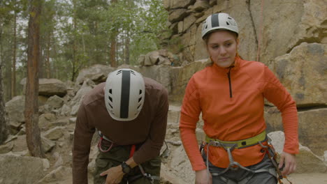 climbers at the bottom of the cliff