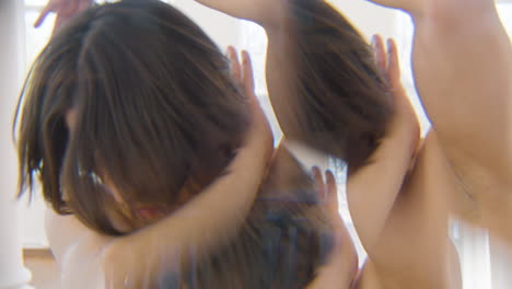 caleidoscopic effect of a focused man performing a contemporary dance in studio