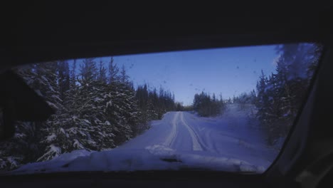 driving on a snowy road. first-person view