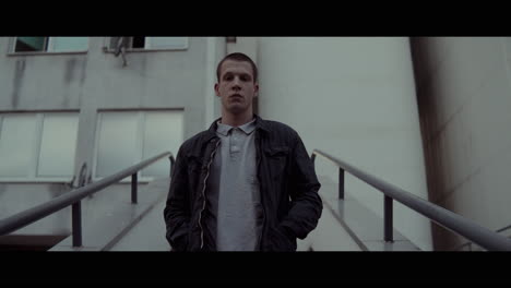 young man on city stairs