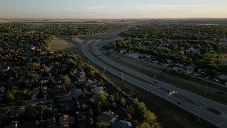 beautiful landscape with greenery surrounding homes and a highway