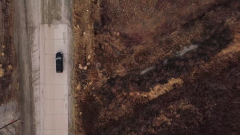 upland game hunting area with travelers in a terrain vehicle, aerial high angle shot