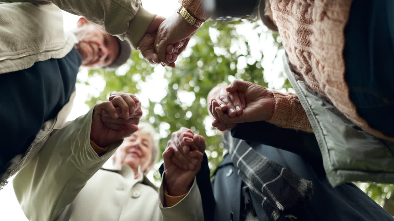 Group of Seniors Holding Hands
