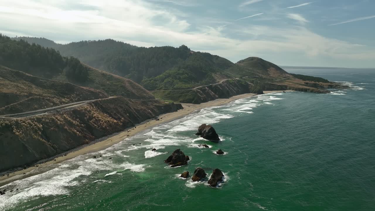 Aerial shot pulling away from one of California's beautiful beaches
