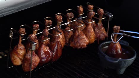 BBQ-chicken-lollipops-on-the-grill-getting-sauced