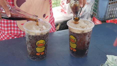 thailand drive beverage pooling cold coke into frozen ice in hot summer