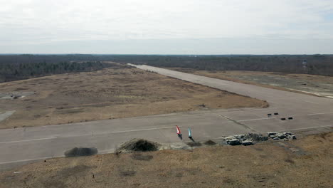 High-drone-footage-of-two-land-yachts-turning-on-disused-airfield