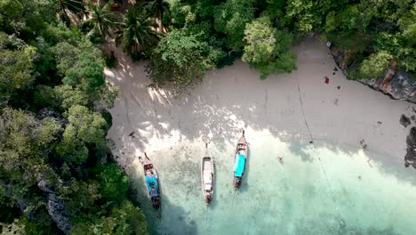 Drone-footage-of-boats-on-the-shore-of-an-deserted-island