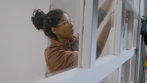 Woman using measuring tape