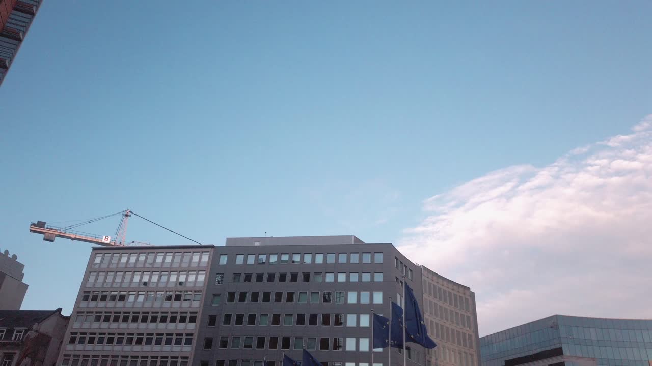 European flags wave under morning sky