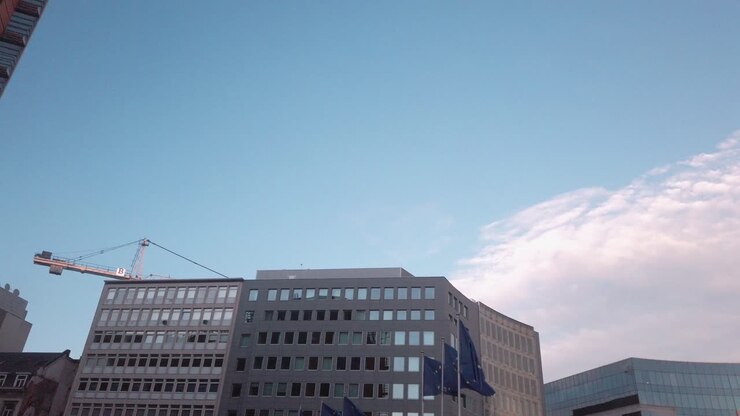 European flags wave under morning sky