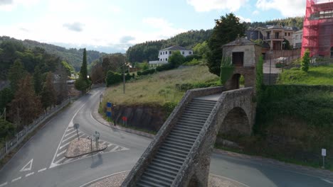 aerial ascending view of the staircase and the chapel of nieves of portomarín, camino de santiago route