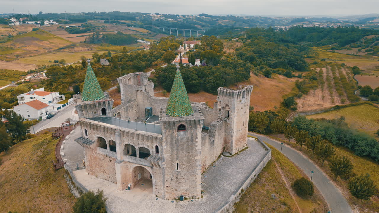 Aerial view of the Castle of Porto de Mos, a historical landmark in Portugal, showcasing its unique architecture and surrounding landscape