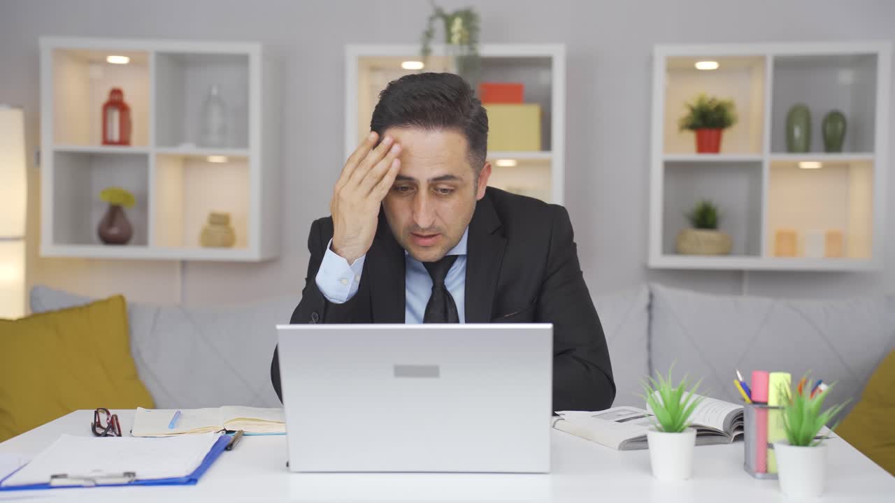 Home office worker man's hands are shaking.