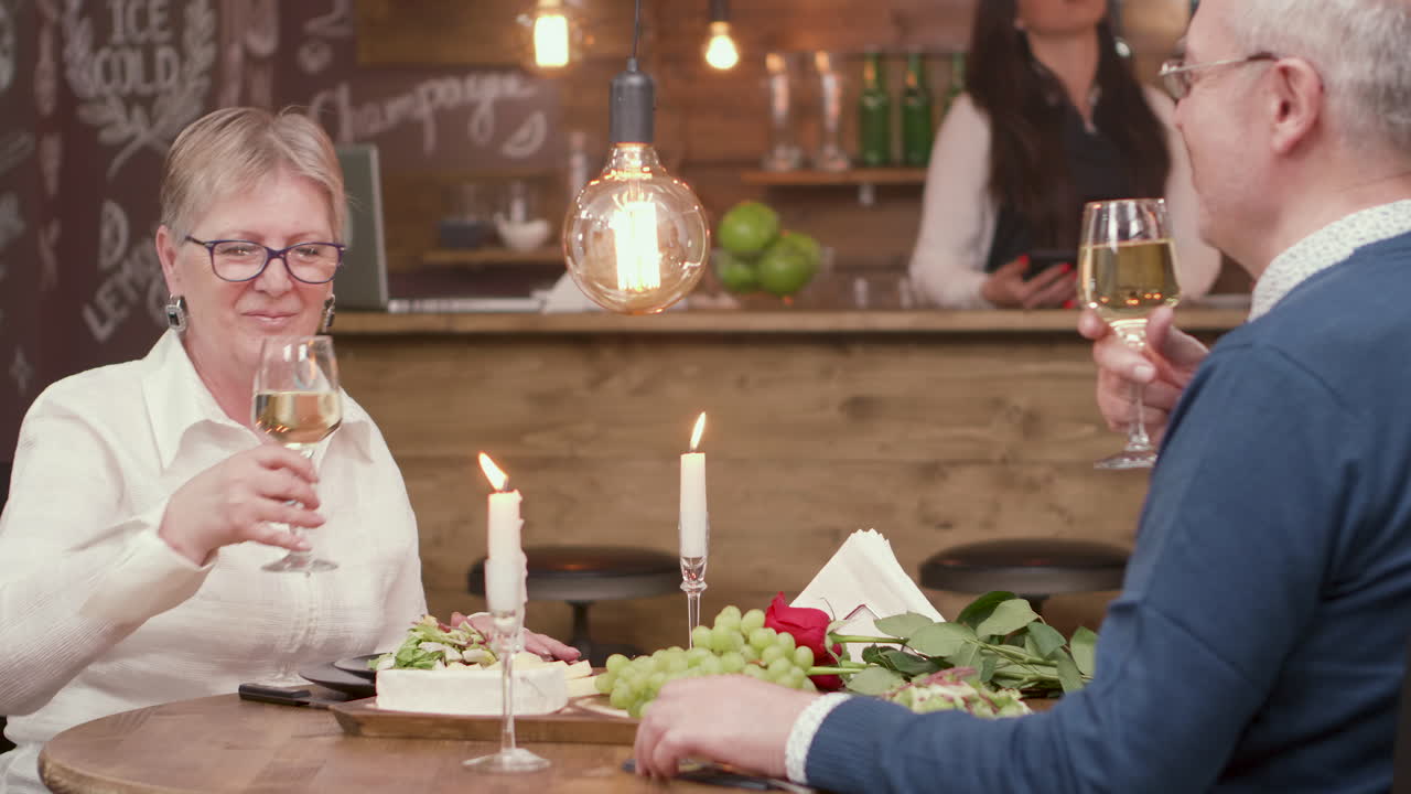 Couple enjoying a romantic dinner with wine