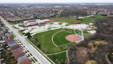 Aerial-shot-circling-over-baseball-diamond-in-spring