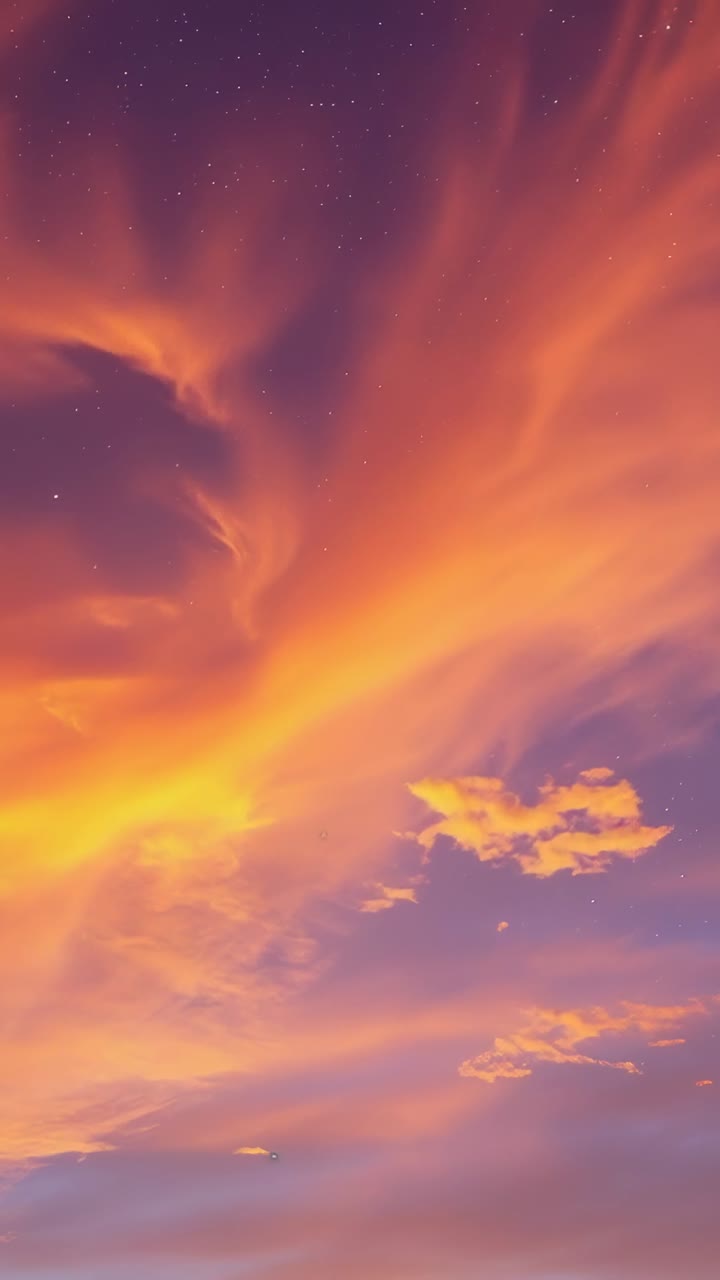 Vertical video: Dusk urging clouds in sky moving glowing showing puffs slant band dark swirl stars