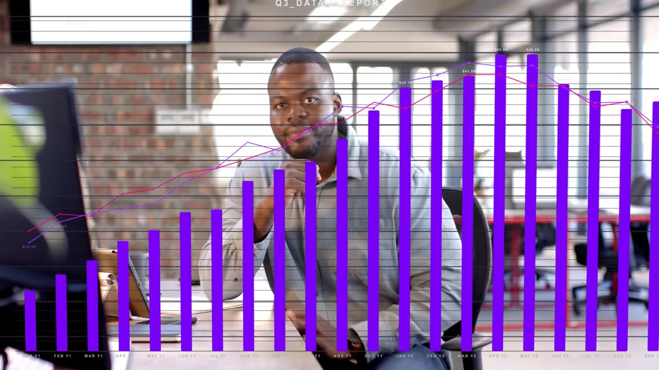 Vertical video: Man tapping tablet and causing purple Q3 bars rising while reviewing business data