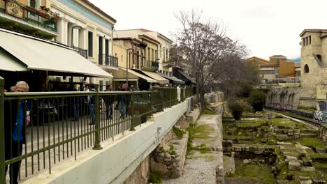 modern greek shops over ancient ruins