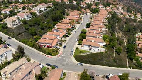 aerial view of a suburban residential neighborhood nestled in hills