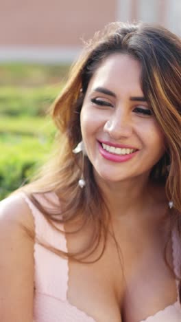 close-up of a beautiful woman smiling outdoors