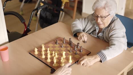 old women playing chess in a geriatric