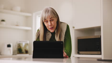 Senior,-woman-and-video-call-on-tablet-with-wave