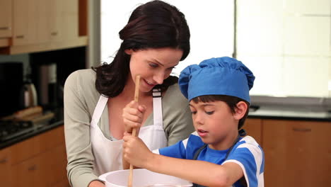 mother and son preparing dough together