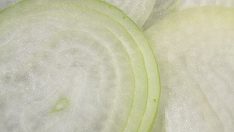 a close-up onion. slices of onions. slicing in circles. raw onions.