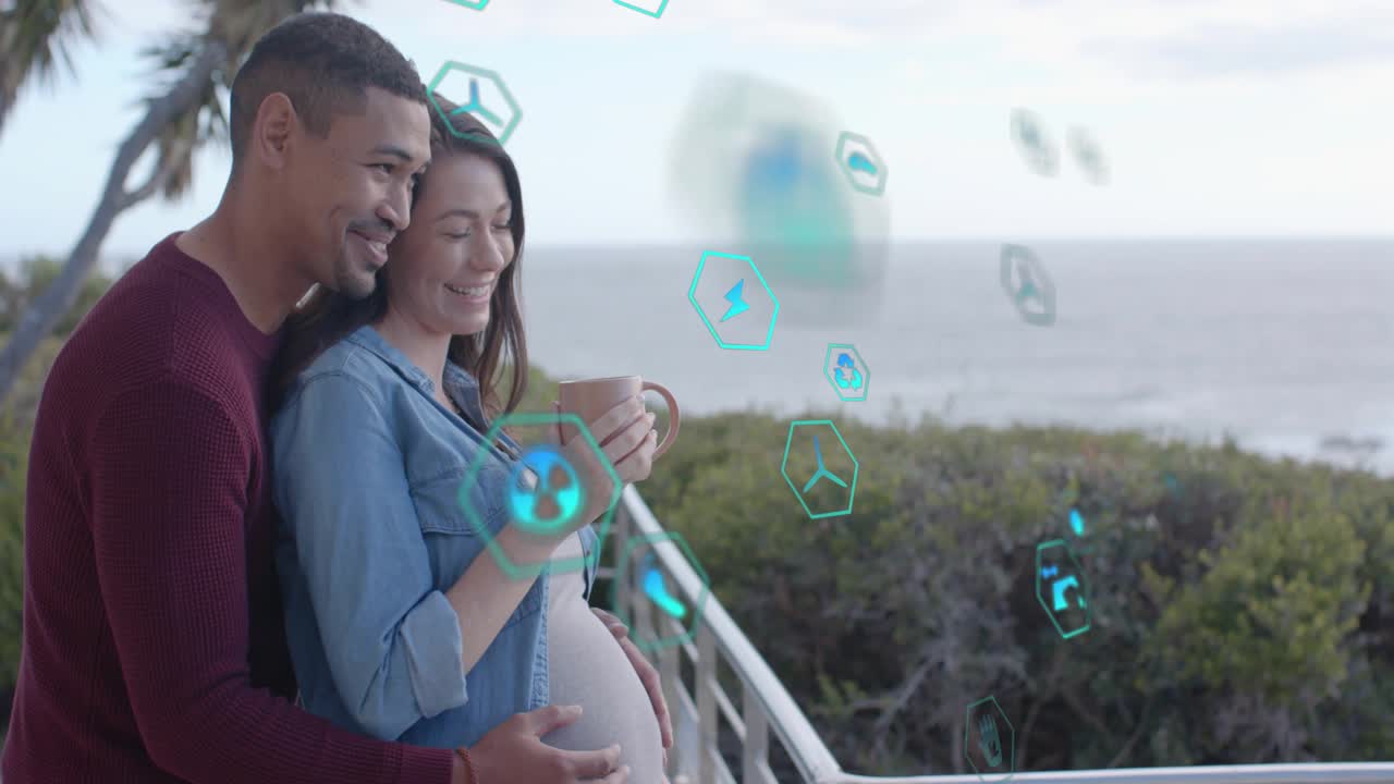 Man walking embracing pregnant woman with mug on deck, teal hexes passing in front prenatal bonding