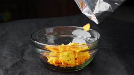 tortilla chips closeup studio shot fall into glass bowl mexican food appetizer