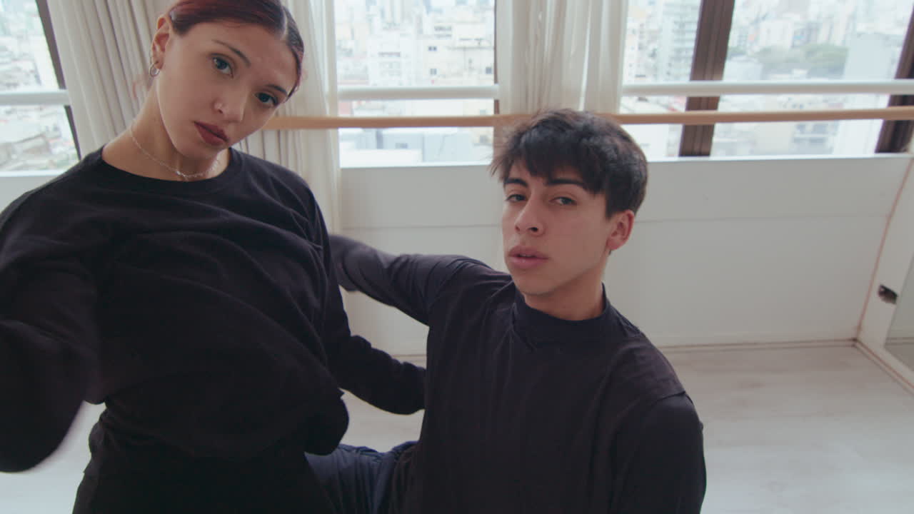 Top Down of Young Partners Looking at Camera and Dancing Contemporary