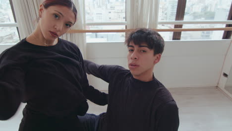 top down of young partners looking at camera and dancing contemporary