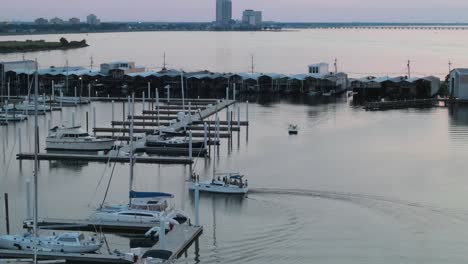 tourist boat sailing back to the port of new orleans yacht club in new orleans, louisiana usa. aerial