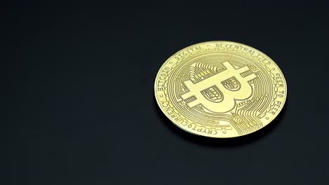 rich golden bitcoin cryptocurrency spinning right slowly with copy space