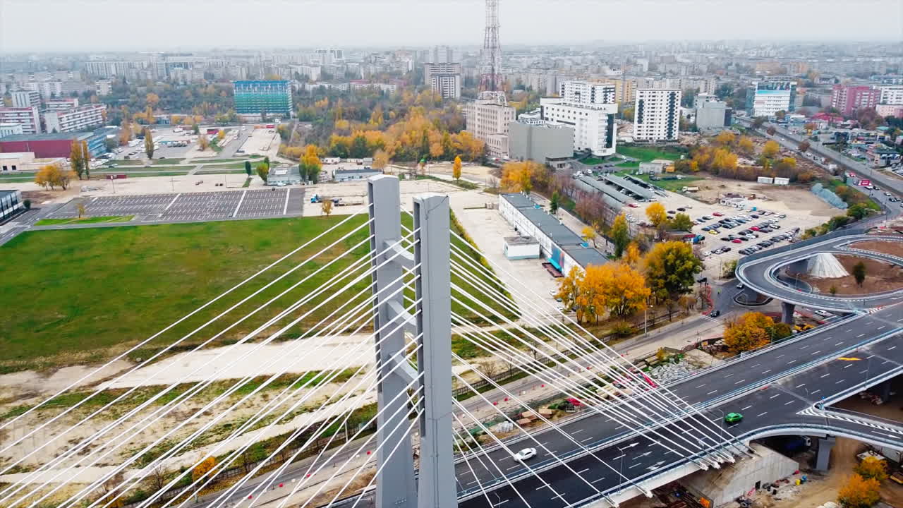 Ciurel passage, bridge over a river with moving cars, construction works near it. View from the drone. Bucharest, Romania