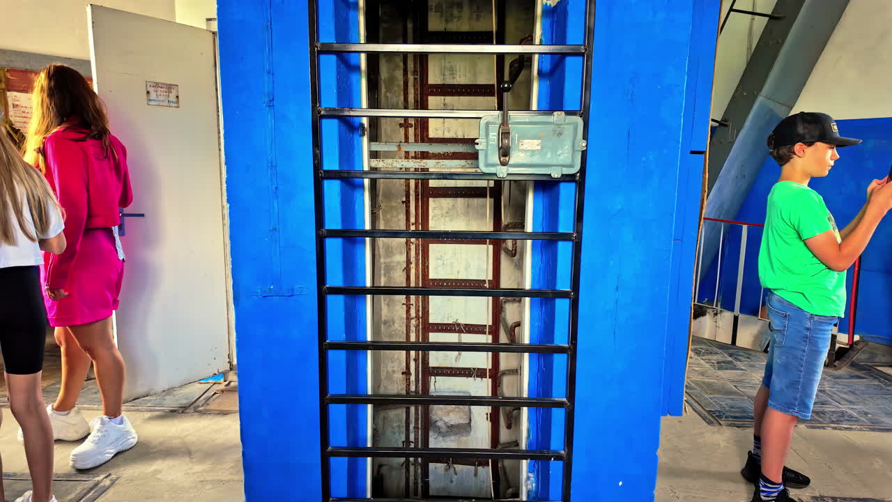 Indoor view of visitors at Irbene radio telescope in Latvia. Surveillance station.