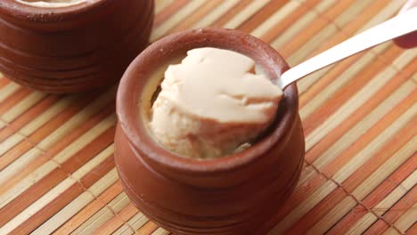 indian style yogurt custard dessert with spoon