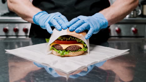 chef preparing a burger in a kitchen