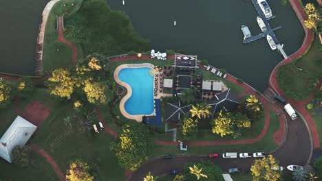 aerial view of tourist complex and dock with boats on the shore of the paraná river, argentina