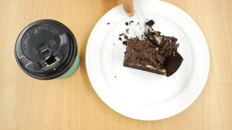 chocolate and cream cake on a plate on table